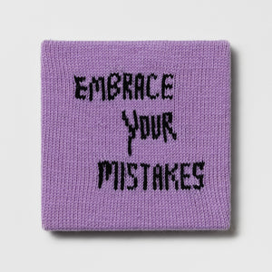 Kate Just, Rule #11: Embrace Your Mistakes, 2024, hand knitted acrylic yarn, canvas, and timber, 26 x 26 cm