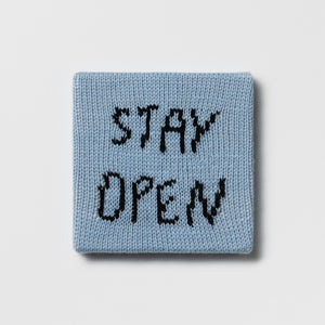 Kate Just, Rule #15: Stay Open, 2024, hand knitted acrylic yarn, canvas, and timber, 21 x 21 cm