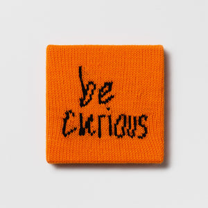 Kate Just, Rule #22: Be Curious, 2024, hand knitted acrylic yarn, canvas, and timber, 21 x 21 cm