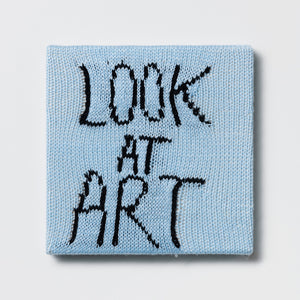 Kate Just, Rule #28: Look at Art, 2024, hand knitted acrylic yarn, canvas, and timber, 26 x 26 cm