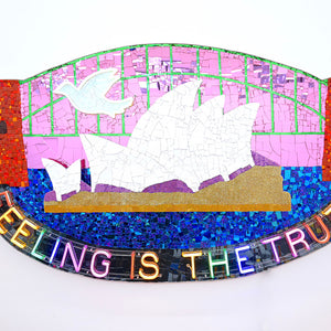 Paul Yore, Sydney Opera House (Feeling Is The Truth), 2025, mixed media assemblage on board comprising plastic, glass, fabric, trim, cotton thread, LED light, wood, synthetic polymer, adhesive, and fixtures, 110 x 186 x 13 cm irreg.