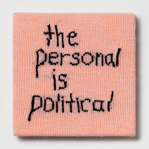Kate Just, Rule #9: The Personal is Political, 2023, hand knitted acrylic yarn, canvas, and timber, 31 x 31 cm