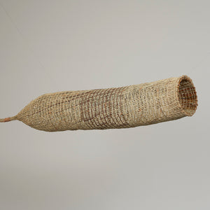 Maureen Ali, An-gujechiya (1098-24), 2024, Pandanus and Bush Cane with, natural dyes , 140 x 23 x 23 cm