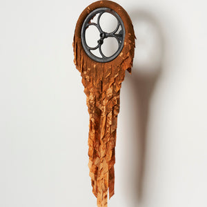 Julia Robinson, It watches with a yellow eye, 2024, linen, thread, bleach, foam, wheel, steel, fixings, 120 x 40 x 25 cm