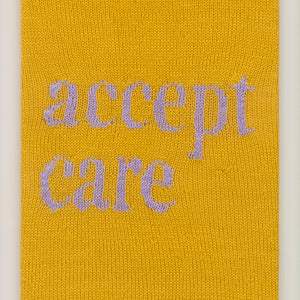 Kate Just, Accept Care, 2023, from Self Care Action Series, hand knitted acrylic yarn, canvas, and timber, 55 x 40 cm