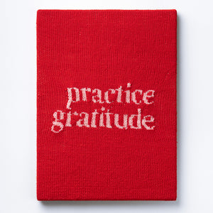 Kate Just, Practice Gratitude, 2023, from Self Care Action Series, hand knitted acrylic yarn, canvas, and timber, 55 x 40 cm