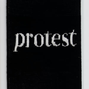 Kate Just, Protest, 2023, from Self Care Action Series, hand knitted acrylic yarn, canvas, and timber, 55 x 40 cm