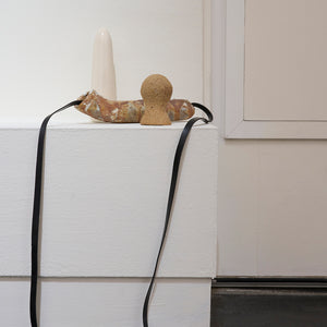 Min Wong, Stop chasing the snake that bit you. Focus on healing and let the poison leave your body., 2024, ceramics and leather cord, 17 x 20 x 15 cm