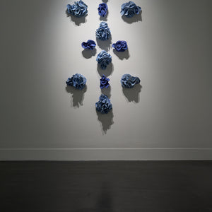Sam Gold, Only through devotion do they leap over lines (installation view, Hugo Michell Gallery), 2024, porcelain and glaze, 158 x 90 x 18 cm irreg.