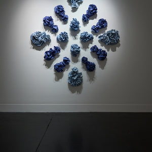 Sam Gold, The marrow in the tide, slowly spills into the mouth of love (installation view, Hugo Michell Gallery), 2024, porcelain and glaze, 185 x 170 x 18 cm irreg.