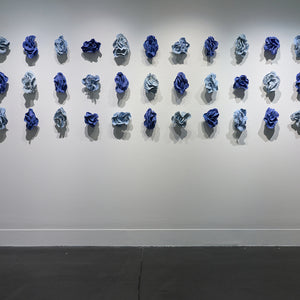 Sam Gold, The restless tension between both poles and how we harmonise them into something beautiful (installation view, Hugo Michell Gallery), 2024, porcelain and glaze, 80 x 161 x 10 cm irreg.