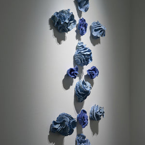 Sam Gold, Only through devotion do they leap over lines (installation view, Hugo Michell Gallery), 2024, porcelain and glaze, 158 x 90 x 18 cm irreg.