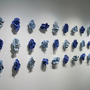 Sam Gold, The restless tension between both poles and how we harmonise them into something beautiful (installation view, Hugo Michell Gallery), 2024, porcelain and glaze, 80 x 161 x 10 cm irreg.