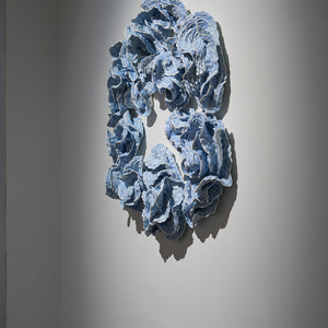 Sam Gold, Muscles holding bones (installation view, Hugo Michell Gallery), 2024, porcelain and glaze, 64 x 69 x 11 cm irreg.