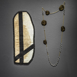 Sera Waters, Familiar Activism: Truth-Telling: Bitumen Doily & Stump Necklace, 2021, hand-dyed linen, felt, cotton, trim, strings, vintage gold Japanese thread, chain and chandelier crystals, 55 x 23 cm