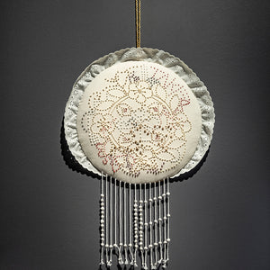 Sera Waters, Soft Truths, 2022, repurposed candlewicking, assorted threads, trim, stuffing, string, handmade clay beads, 65 x 35 cm