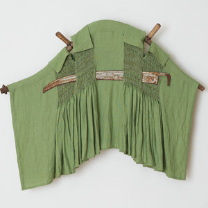 Julia Robinson, Burrow Mump, 2022, linen, thread, scythe handle, blade, steel, 110 x 130 x 25 cm