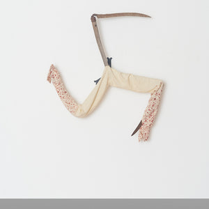 Julia Robinson, In comes I, linen, 2021, thread, scythes, steel, fixings, 140 x 130 x 25 cm