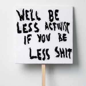 Kate Just, We’ll Be Less Activist If You Be Less Shit, 2021, knitted wool as placard with plywood stand, 64 x 64 cm