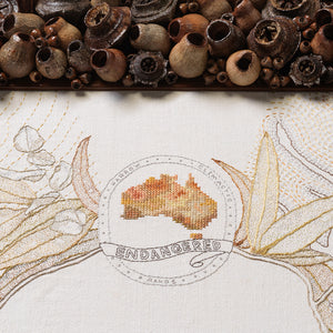 Sera Waters, Suckers: Coat of (lopped) Arms, 2021, found gumnuts, repurposed vintage linen, various threads, 133 x 105 x 7 cm
