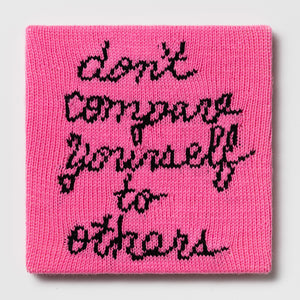 Kate Just, Rule #14: Don't Compare Yourself to Others, 2024, hand knitted acrylic yarn, canvas, and timber, 31 x 31 cm