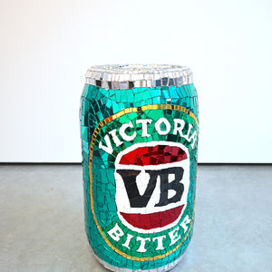 Paul Yore, Victoria Bitter Can, 2025, mixed media sculptural assemblage on plastic comprising plastic, glass, crockery, found objects, wood, adhesive, synthetic polymer, and fixtures, 53 x 32 x 32 cm
