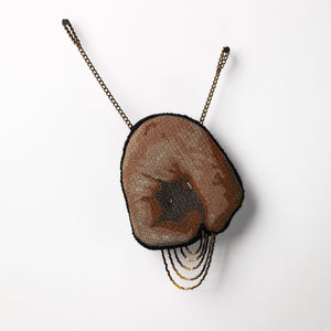 Sera Waters, Patterns of Min(e)ing: Flesh Tunnel, 2025, cotton, linen, glow-in-the-dark thread, beads, repurposed chain, stuffing, felt, approximately 20 x 16cm (installed). Photo by Grant Hancock
