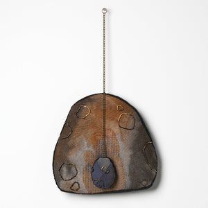 Sera Waters, Patterns of Min(e)ing: Plundered Core, 2025, cotton, linen, hand-dyed calico, beads, repurposed chain, stuffing, felt, approximately 35cm x 20cm (installed). Photo by Grant Hancock