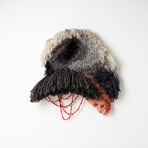 Sera Waters, Parts of Past Portents: head shot, 2025-26, various repurposed wools, found and handmade beads, 52 x 50 cm irreg. Photography by Grant Hancock
