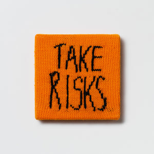 Kate Just, Rule #27: Take Risks, 2024, hand knitted acrylic yarn, canvas, and timber, 21 x 21 cm
