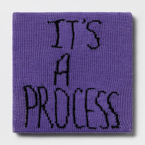 Kate Just, Rule #40: It's a Process, 2024, hand knitted acrylic yarn, canvas, and timber, 31 x 31 cm