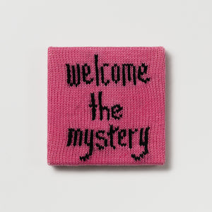 Rule #43: Welcome the Mystery, 2024, hand knitted acrylic yarn, canvas, and timber, 21 x 21 cm