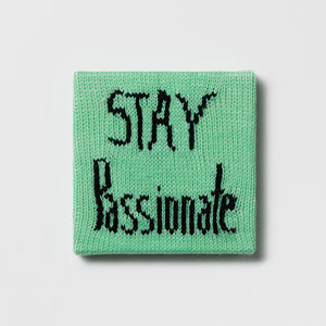 Kate Just, Rule #48: Stay Passionate, 2024, hand knitted acrylic yarn, canvas, and timber, 21 x 21 cm