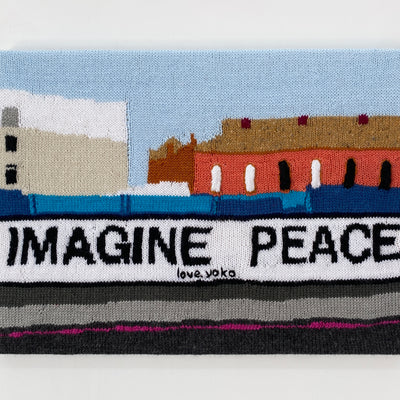 Kate Just, A Sign of the Times: A knitted translation of Yoko Ono, Imagine Peace billboard, 2022, Dalston Junction, London, 2026, hand knitted acrylic yarn, timber, canvas, 41 x 56 cm