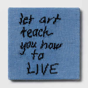 Kate Just, Rule #8: Let Art Teach You How to Live, 2024, hand knitted acrylic yarn, canvas, and timber, 31 x 31 cm