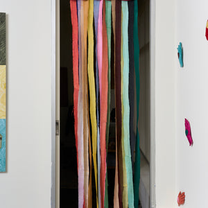Katre Mitchell, Lucky Hag (in the doorway), 2025, velvet, stuffing, silk ribbons, lucky four-leaf clover water, 260 x 70 x 5 cm
