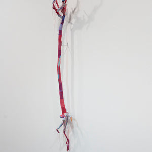 Olga Cironis, Roses are Red, Violets are Blue, 2018, rose bush, wool blanket, and thread, 125 x 30 x 30 cm