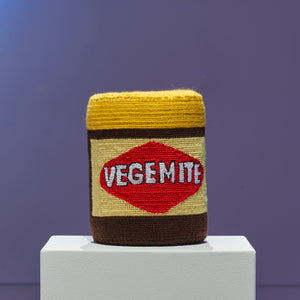Paul Yore, Vegemite Jar (installation view), 2025, acrylic yarn needlepoint, cotton thread, and board (ongoing open edition), 18.5 x 15 x 15 cm