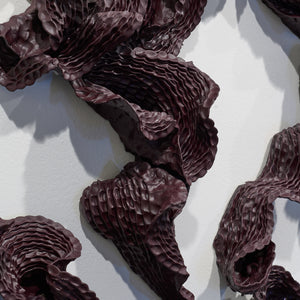 Sam Gold, Give everything to the sea (detail), 2026, dirty porcelain & heat cured enamel, 91 × 330 × 13 cm