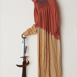 Julia Robinson, It does not dally, 2023, linen, thread, wooden handle, scythe blades, nails, steel and fixings, 180 x 95 x 35 cm