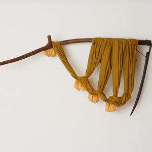 Julia Robinson, King of limbs, 2023, linen, thread, scythe, steel and fixings, 80 x 140 x 30 cm