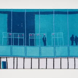 Kate Just, A Sign of the Times: A knitted translation of Demian DinéYazhi, we must stop imagining apocalypse / genocide + we must imagine liberation, 2024 installed facing the window out of the Whitney Museum during the Whitney Biennial, 2026, hand knitted wool and acrylic yarn, timber, canvas, 60 x 86 cm