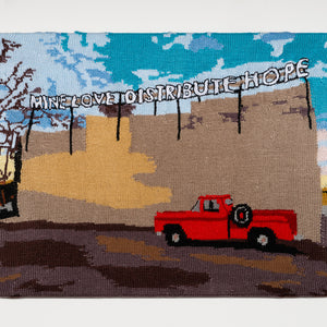 Kate Just, A Sign of the Times: A knitted translation of Robert Montgomery: MINE LOVE, DISTRIBUTE HOPE, 2019, Fort Smith, Arkansas, as part of The Unexpected, an urban and contemporary art project (2026), 2026, hand knitted acrylic yarn, timber, canvas, 56 x 72 cm