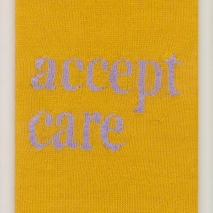 Kate Just, Accept Care, 2023, from Self Care Action Series, hand knitted acrylic yarn, canvas, and timber, 55 x 40 cm 