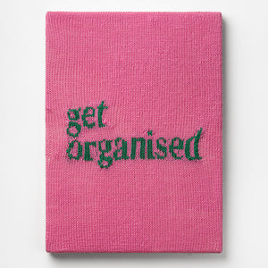 Kate Just, Get Organised, 2023, from Self Care Action Series, hand knitted acrylic yarn, canvas, and timber, 55 x 40 cm 