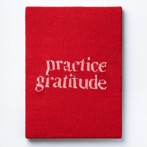 Kate Just, Practice Gratitude, 2023, from Self Care Action Series, hand knitted acrylic yarn, canvas, and timber, 55 x 40 cm 