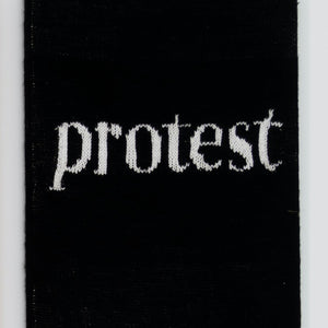 Kate Just, Protest, 2022, acrylic yarn, timber and canvas, 55 x 40 cm. Photography by Simon Strong