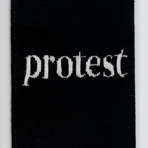Kate Just, Protest, 2023, from Self Care Action Series, hand knitted acrylic yarn, canvas, and timber, 55 x 40 cm 