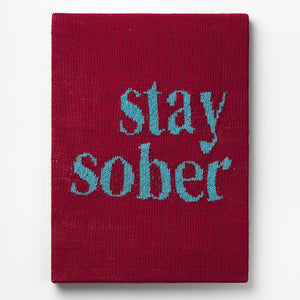Kate Just, Stay Sober, 2023, from Self Care Action Series, hand knitted acrylic yarn, canvas, and timber, 55 x 40 cm 