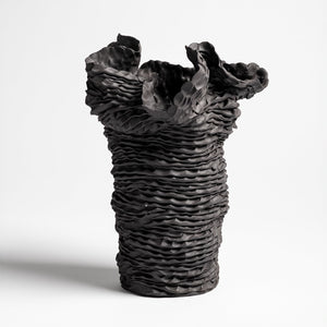 Sam Gold, A waxiness, 2023, black stoneware and quartz, 29 x 24 cm irregular